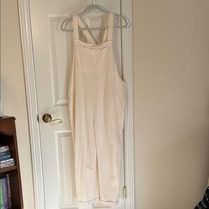 Cream Jumpsuit with front pocket, size M